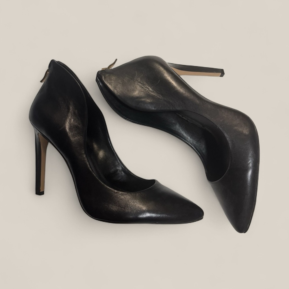 BCBG Generation Elegant Black Leather Stiletto Heels with Zipper detail.